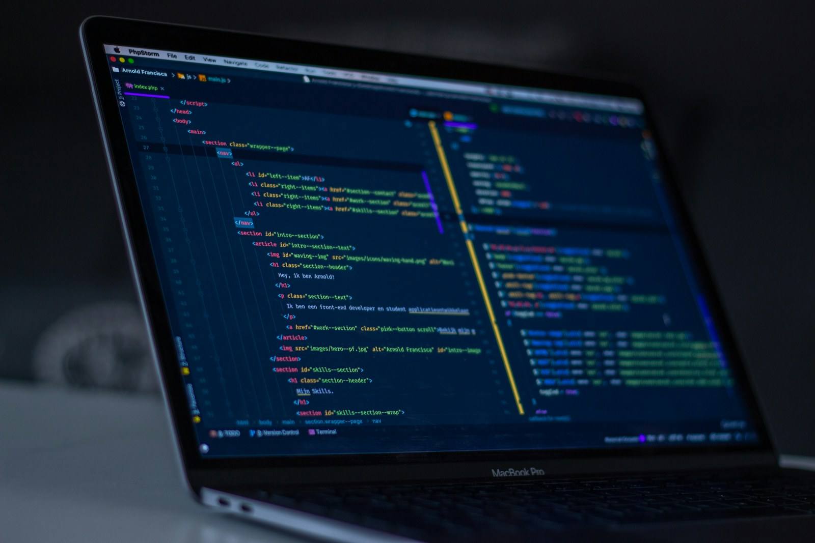 Source code displayed on a laptop screen