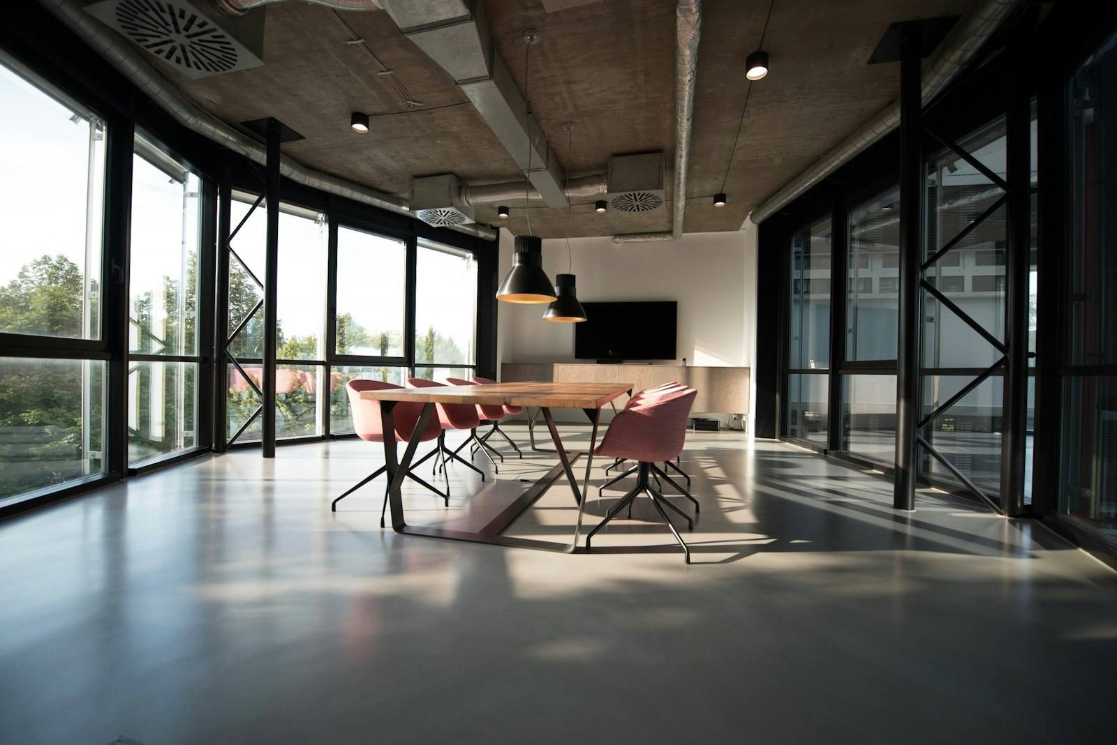 A modern open-plan office with meeting space